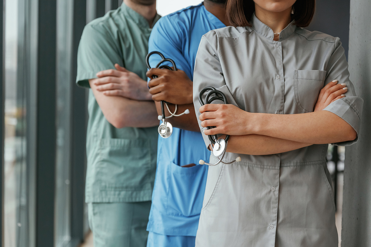 With stethoscope. Group of doctors are together indoors.